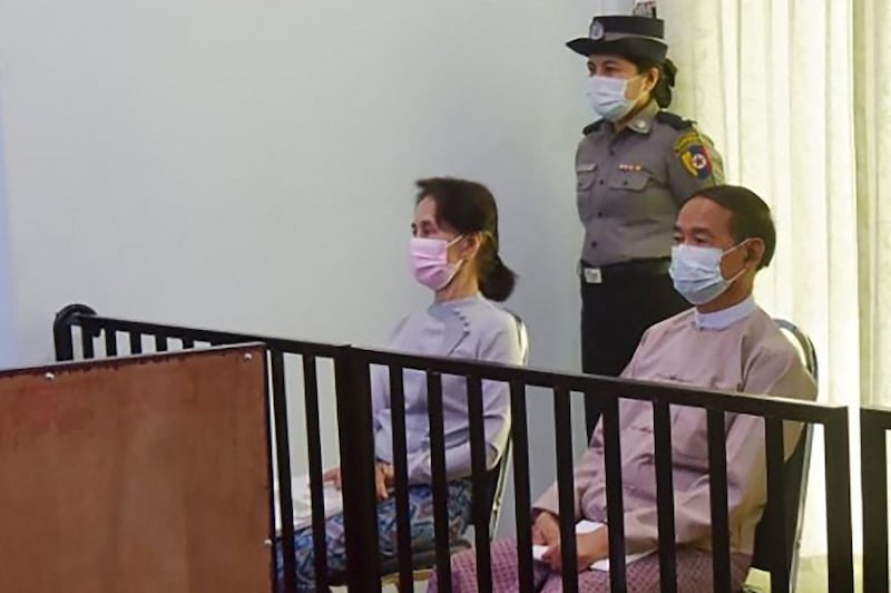 Detained Myanmar State Councilor Aung San Suu Kyi (L) and president Win Myint (R) during their first court appearance in Naypyidaw, May 24, 2021.